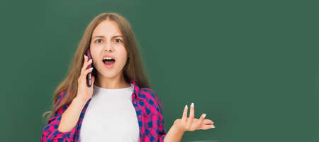 conversation. aggressive teen girl wear retro clothes. Portrait of schoolgirl student, studio banner header. School child face, copyspace.の写真素材