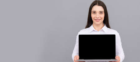 Woman isolated face portrait, banner with mock up copy space. woman showing laptop screen. modern...