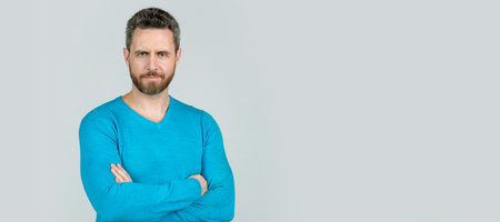 Man face portrait, banner with copy space. handsome mature man with beard on grey background, style.