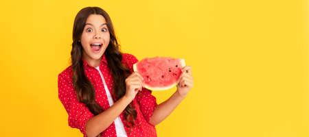 summertime. surprised child hold water melon slice. yummy juicy watermelon. Summer girl portrait with watermelon, horizontal poster. Banner header with copy space.の写真素材