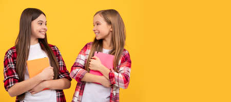 School girls friends. happy teen girls in casual checkered shirt with notebooks, sisterhood....