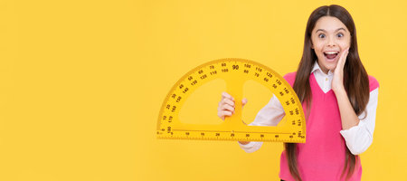 amazed child girl study geometry at school lesson with ruler, stem disciplines. Portrait of...
