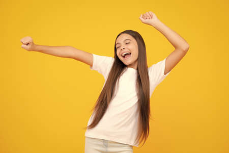 Excited teenager, glad amazed and overjoyed emotions. Portrait of emotional positive teenage child girl shouting in amazement or astonishment face, astonished with surprise.の写真素材