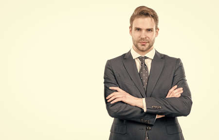 Serious confident man employee in formal suit keep arms crossed, confidenceの写真素材
