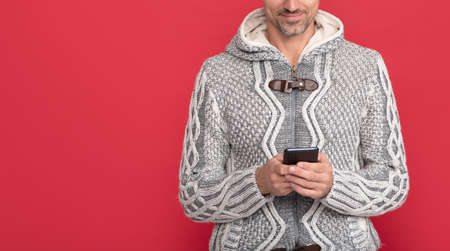 male fashion model hold smartphone. concept of modern communication.