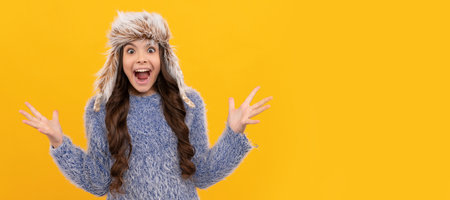 female fashion model. teen girl in knitwear on yellow background. Banner of child girl in winter...