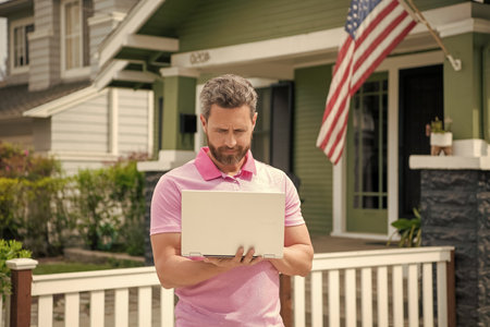 real estate agent work online on laptop. rent or buy new home. home insure. property insurance promotionの写真素材