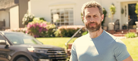 real estate dealer outdoor at the house and car. copy space. Man face portrait, banner with copy...