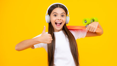 Teen hipster girl skater with skateboard on isolated background. Summer kids trend, urban teenage...