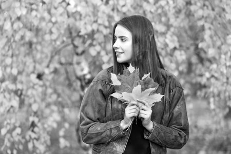 beautiful face portrait. natural beauty. fall season fashion. girl enjoy weather with autumn leaves.の写真素材