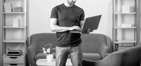 freelancer writing online. guy using laptop for blogging. social network and weblog.の写真素材