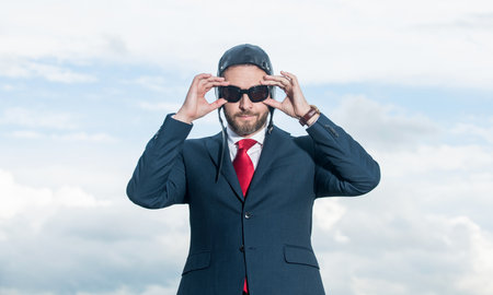 man in suit and pilot hat get readyの写真素材
