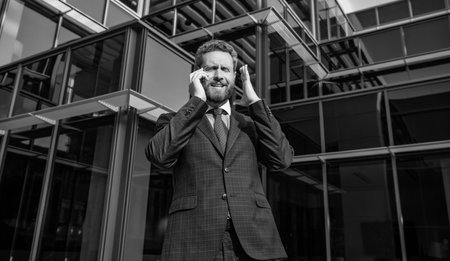 phone call. mobile connection technology. communication. frustrated businessman speak on smartphoneの写真素材