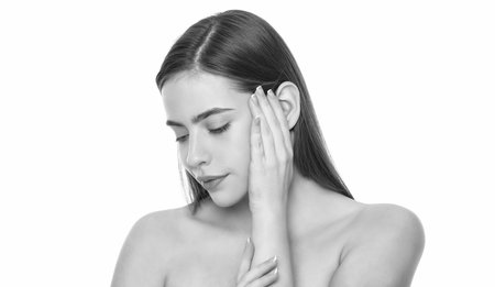smooth and soft female skin. woman touch smooth face. young girl with bare shoulders.の写真素材