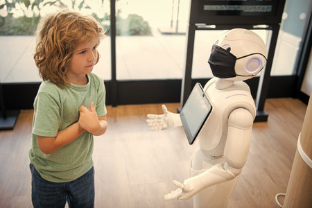 little boy interact with robot artificial intelligence, future techの写真素材