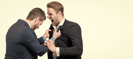 Man face portrait, banner with copy space. disagreed men business partners or colleague disputing while conflict, businessmen conflict.の写真素材