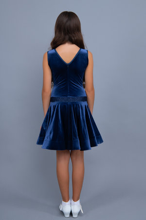 Back view of young graceful teenager child in dress isolated on gray background.の写真素材