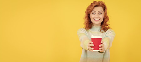 take this. happy red haired woman drink coffee. take away beverage. cheerful girl drinking tea....