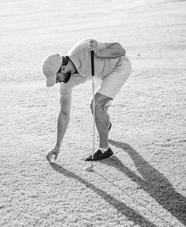 summer activity. professional sport outdoor. male golf player on professional golf course.の写真素材