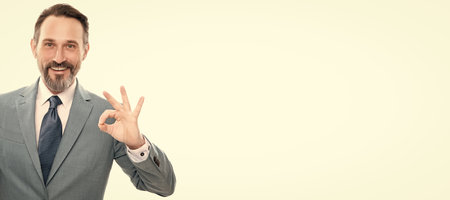 Man face portrait, banner with copy space. advertisement presentation. copy space. grizzled man presenting phone screen.の写真素材