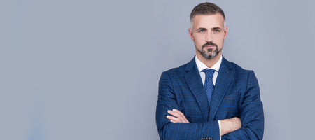 confident businessman man in businesslike suit crossed hands, confidence. Man face portrait, banner...