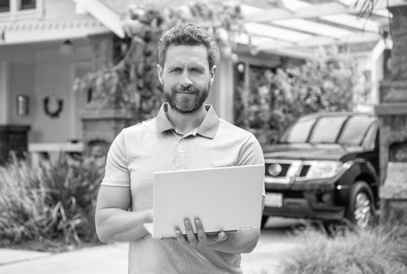 american settlement agent work on computer. real estate agent sell property. realtor in suburbの写真素材