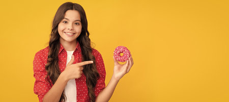 happy kid point finger on sweet glazed donut, foodの写真素材