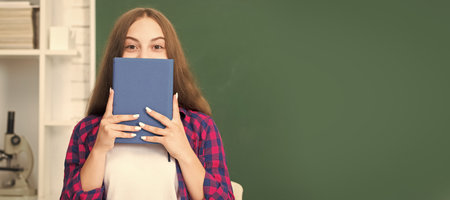 back to school. teen girl ready to study. kid do homework with book. teenager student. Banner of school girl student. Schoolgirl pupil portrait with copy space.の写真素材