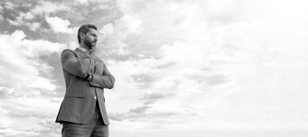 Man face portrait, banner with copy space. Business man in suit, blue sky background. man bride...