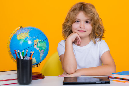 School kid 7-8 years old with book go back to school. Little student. Education concept.の写真素材