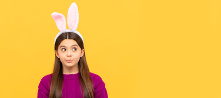 thoughtful teen child in easter bunny ears, easter holiday. Easter child horizontal poster. Web...