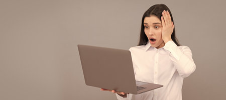 Woman isolated face portrait, banner with mock up copy space. shocked businesswoman with laptop....