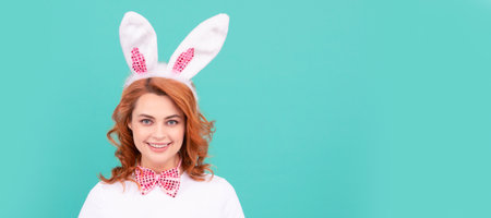 Woman isolated face portrait, banner with mock up copyspace. positive woman in easter bunny ears...