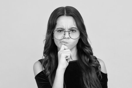 Thinking pensive clever teenager girl. Beautiful teenager child 12, 13, 14 years old over isolated...