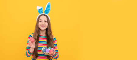 pure happiness. adorable funny kid on egg hunt. easter spring holiday. happy teen girl. Easter child horizontal poster. Web banner header, copy space.の写真素材