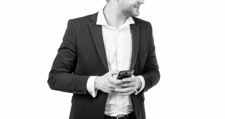 Wireless solution for business. Businessman cropped view hold mobile phone. Mobile communicationの写真素材