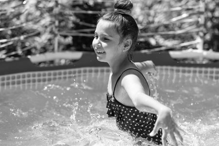 Swimming is my happy hour. Happy child swim in swimming pool. Leisure and recreationの写真素材