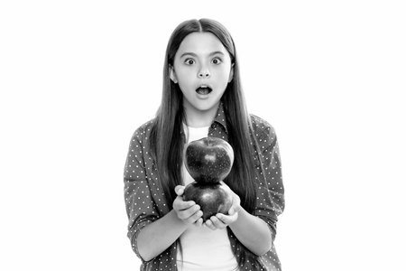 Teenager child girl biting tasty green apple.の写真素材