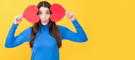 Beautiful amazing woman cuddle paper card heart shape, dreamy isolated on yellow background. Woman...
