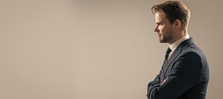 Boost your confidence. Confident guy sideway grey background. Confidence. Man face portrait, banner with copy space. Business man in suit, isolated studio background.の写真素材