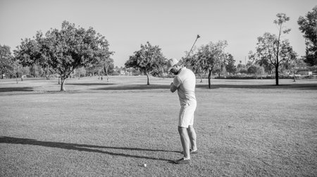 male golf player on professional course with green grass, golfの写真素材