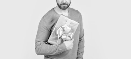 cropped man with beard holding present or gift box, saleの写真素材