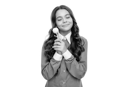 dreamy face of teen girl hold sweet chocolate candy isolated on white, sweet tooth.の写真素材