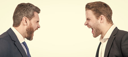 Man face portrait, banner with copy space. two businessmen shouting in business conflict, confrontation.の写真素材