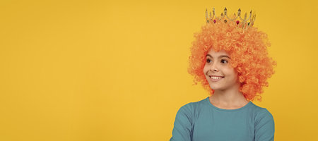 nice smile. imagine herself a princess. funny child in diadem. selfish teen girl in tiara. Funny teenager child in wig, party poster. Banner header, copy space.の写真素材