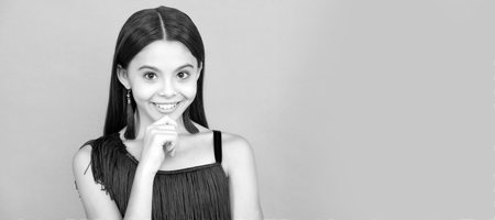 Get beautiful skin. Cute girl with happy look. Skin beauty. Skincare and treatment. Child face, horizontal poster, teenager girl isolated portrait, banner with copy space.の写真素材