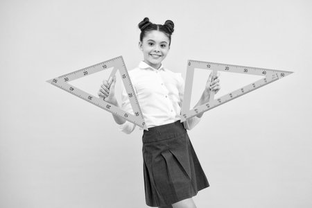 Back to school. Teenager school girl on blue background. School supplies. Happy teenager, positive and smiling schoolgirl.の写真素材