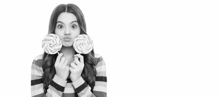 funny kid in colorful sweater hold lollypop. sugar candy on stick. caramel candy shop. Teenager child with sweets, poster banner header, copy space.の写真素材
