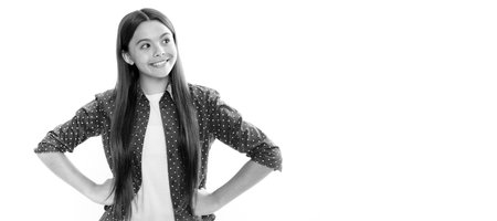 Portrait of happy smiling teenage child girl. Pretty teenage girl in white studio background. Child girl portrait. Child face, horizontal poster, teenager girl isolated portrait, banner with copy space.の写真素材