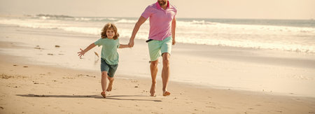 childhood and parenting. cropped father and son running on summer beach. family travelの写真素材